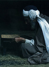 man reading Qur'an